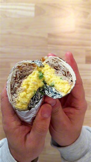 My version of a damn good breakfast wrap 🌯🍳 The essentials of any great breakfast wrap or sandwich are eggs, meat, and cheese but what really makes it shine is the meat you choose, how you cook your eggs, and the cheese you use. This is how I make a seriously delicious breakfast wrap, and trust me no matter what you choose for meat and cheese…the soft-scrambled eggs are the key! Ingredients: Serves 1 - 2 Eggs - 1 tbsp butter - 1 cup Sharp Cheddar & Parm mixed - 3-4 slices Porchetta (but you ca
