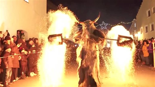 Masked devils swing fire in Bavarian festival