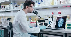 Man, scientist and microscope in forensic, analysis or data science for new discovery or research at lab. Male person, medical or healthcare professional working on technology in science laboratory