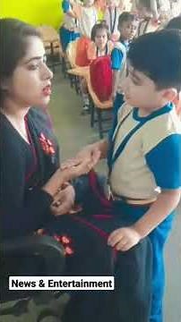 Cute Kid Kissing Teacher in Classroom