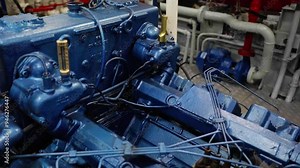 Engine of boat.The engine room of a boat with valves, vents, exhaust, pipes and plumbing