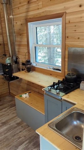 Spending time in the Tiny Cabin is one of my favorite things to do with the family, it's so relaxing and cozy, a few more finishing touches and we might actually be ready to rent thing thing out. It's quite the hike to get to and 100% off grid, propane cook top, Cubic Mini Wood Stove & loft with queen-sized bed! #modernhomestead #tinyhome #offgrid #family #intheforest #outdoors | Modern Homestead