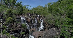 4K descending tracking aerial view of Cedar Creek Waterfall in good flow, Cedar Creek Falls is situated between Proserpine and the town of Airlie Beach. proserpine,Queensland,Australia