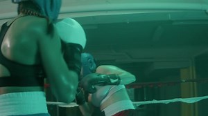 Free stock video - Two female boxers in helmets and boxing gloves training in ring