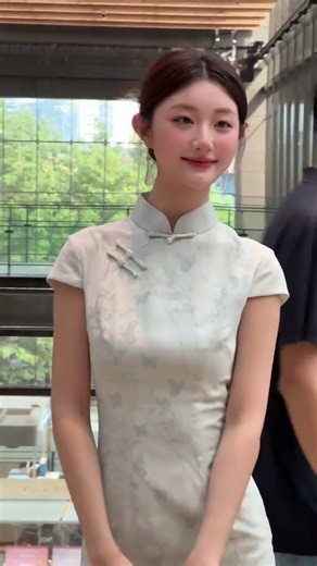 Butterfly pattern, light blue midi Qipao. Credit to Xiaohongshu:@ 26257860798