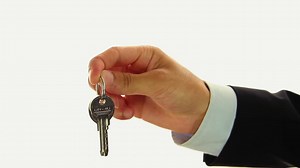 Premium stock video - Businessman handing keys of house