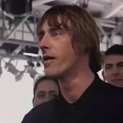 Some of Oasis' most powerful songs were also their most understated. Written by Noel Gallagher during a difficult period on the band's first American tour, "Talk Tonight" became a heartfelt acoustic favourite that revealed a more reflective side to his songwriting. This special performance with Paul Weller adds another layer to the song, bringing together two of Britain's most influential musicians for an unforgettable rendition.