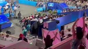 Woman holds up giant ‘XX’ banner whilst staging a protest at the Paris Olympics. Bravo 👏 👏 💪 | Real Jesse Holguin