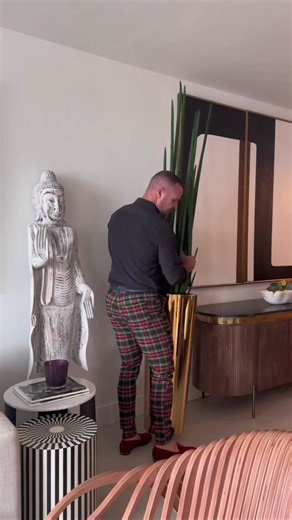 At #cfadesigngroup, we specialize in transforming artificial flowers into stunning sculptural works of art. What sets our designs apart is not only our impeccable craftsmanship and attention to detail, but also our unique approach to overall design. We believe in making a bold statement when the space or our clients' homes allow and call for it. One of our standout creations is the oversized San Jose plants on glossy black, paired with cascading black orchids and organic California ghost wood. T