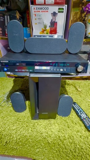 Julz Enterprise on Instagram: "N165,000 This is a Samsung 5.1-channel home theater system, likely the HT-X30 or HT-X40 model. It is an all-in-one system designed to reproduce a movie theater audio experience at home. The system includes a main DVD player/receiver unit, a subwoofer, and five satellite speakers. Key features often include HDMI connectivity, a USB port for media playback, and DivX/MP3 support. The system delivers powerful audio output, with some models rated at up to 800 watts. Dm