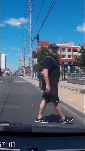 Watch Jaywalker Glares At Driver And Runs Into pole , Instant Karma , Runs in to Pole