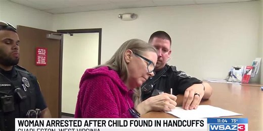 Woman arrested after child found in handcuffs
