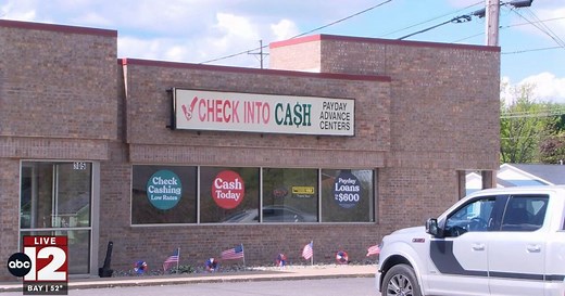 Midland police investigating an armed robbery at Check Into Cash
