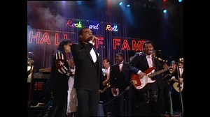 A little bit louder now, a little bit louder now. The celebration of Motown Records' 60th anniversary continues, so throw your hands up and enjoy this The Isley Brothers performance of "Shout" at the 1990 Induction Ceremony. | Rock & Roll Hall of Fame