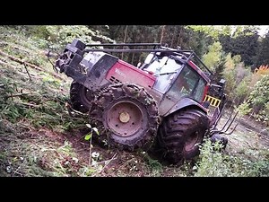 Valtra forestry tractor logging on steep slopes, slippery uphill, difficult conditions