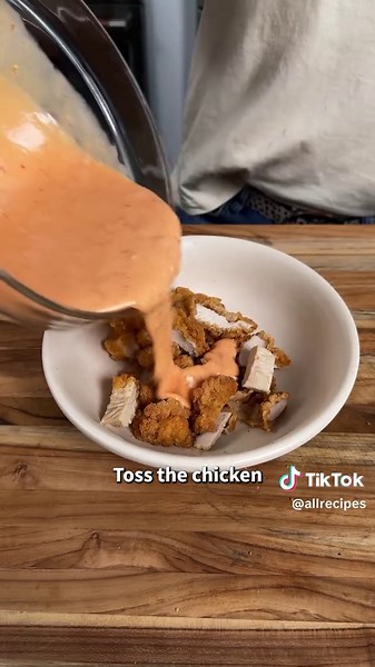 Bang Bang Chicken Burritos are EVERYTHING! 🌯🤤 They're a certified 12/12! Get the full recipe in the @allrecipes bio or keep reading. Ingredients: 1/2 cup mayonnaise 1/4 cup sweet chili sauce 2 tablespoons Sriracha 12 frozen crispy chicken strips 4 (10 to 12-inch) flour tortillas 2 cups coleslaw mix Directions: Stir mayonnaise, chili sauce, and Sriracha sauce together in a small bowl until well combined and set aside. Prepare chicken strips in the air fryer according to package directions and c