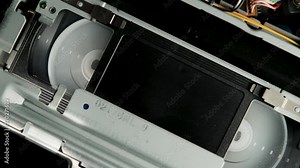 Fast rewind of VHS old vintage tape cassette without sign. retro VCR player. Old vintage tape on the video, audio tape recorder or player.