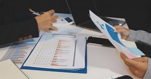Accountant or banker making calculations Bookkeeper Clerk, Bank Advisor And Auditor. Accounting concept.