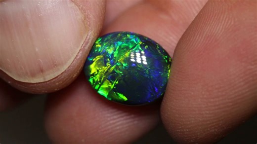 11K views · 476 reactions | ⭐️ Collector's Gem ⭐️ An N1 body tone with a vivid (B5) brightness, what an incredible combination for a black opal. The green and blue play of color comes alive in the asteria, straw and script patterns dancing across the face of the gem. 7.55ct gem black opal 14x11.1x7.4mm https://blackopaldirect.com/products/7-55-ct-gem-black-opal-14x11-1x7-4mm | Black Opal Direct | Facebook