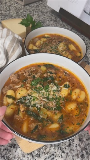 Ally Rolla on Instagram: "Italian sausage & gnocchi soup 🍜🍅🌿 recipe below! ✨ Ingredients: - 1 onion - 3 celery stalks - 2 cups fresh spinach, chopped - 1 lb ground Italian sausage - olive oil - garlic - Italian seasoning - red pepper flakes - salt & pepper - 1 tablespoon flour - 3 tablespoons tomato paste - 8oz tomato sauce - parmesan rind - 6 cups chicken broth - 16oz gnocchi Instructions: - heat olive oil in a large pot or dutch oven (mine is from @caraway_home - code “EATSWITHALLY10” will