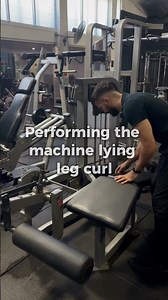 Machine lying leg curl exercise demonstration