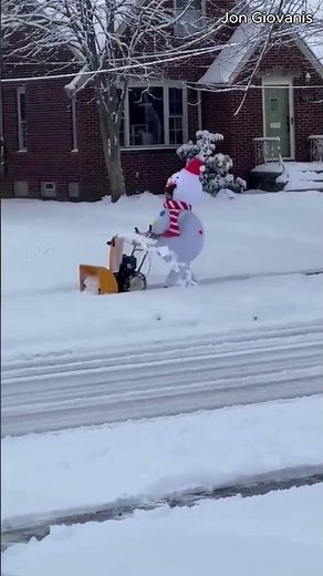 Snowman helps clear the sidewalks in Fairview Park