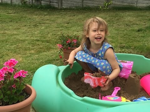 How to build sandcastles - unwrapping kids play sand and unwrapping new sand pit toys