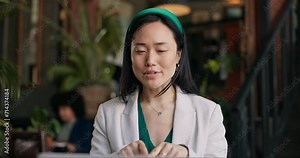 Woman, video call and restaurant with laptop, remote work and conversation for project, meeting and internet. Discussion, job and explain feedback to copywriter and working on social media campaign