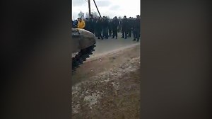 Ukraine: Civilians block path of Russian tanks, surround them in human shield