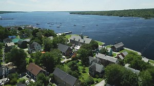 Aerial view of historic Shelburne harbour's Fishing Industry Tribute Memorial Park and Museums by The Sea, Nova Scotia, Canada. MAX QUAL PRORES422HQ Transcode of 4K H.265 D-CINELIKE original capture.