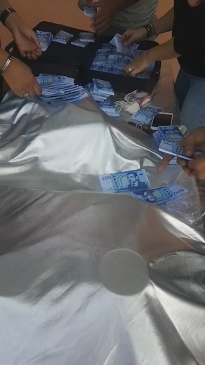 Counting and Sorting 200 Denomination Banknotes Outdoors