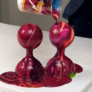 It's about time to get started on Christmas projects! Acrylic pouring on ornaments is so easy and fun :) YES, you can pour the paint on the inside if you want, but it won't give you this look at all and I prefer it on the outside. Also note that there is a canvas underneath to catch the runoff. I also use the paint left on the funnels to make jewelry and other projects :) | Mixed Media Girl