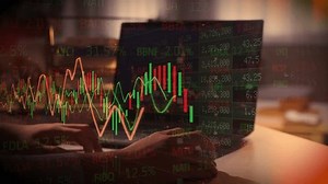 Stock ticker with prices, percentage changes. Abstract ticker board, financial , screen, business, trader is working with multiple computer screens full of charts and data analysis