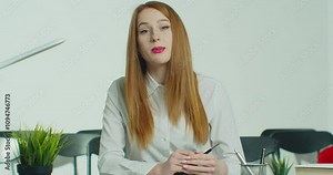 Businesswoman talking consulting client online make conference call job interview look at camera record online training, video conference concept webcam view.