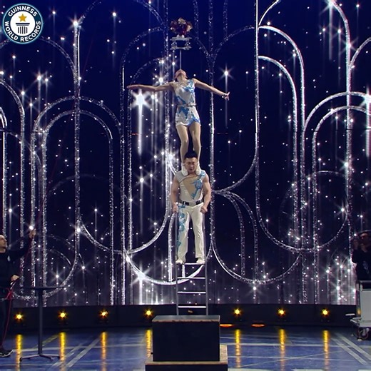 2.6M views · 92K reactions | China's Lijuan Feng and Lijun Liu completed this unbelievable ladder stunt 勞 | Guinness World Records | Facebook