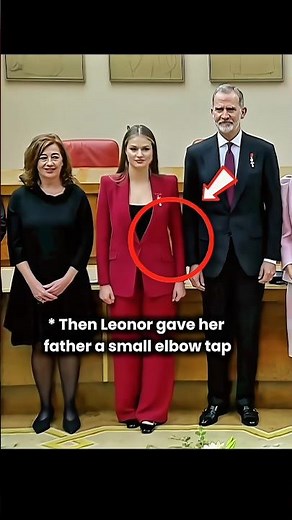 princess Leonor signalling king Felipe by her elbow