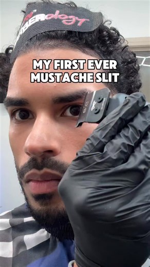 Dallas Barber • Angel on Instagram: "My first ever mustache slit💈🔥 Would you rock it? In need of a curly haircut or facial hair style? Link in bio 13465 Inwood Rd 185 Dallas, TX 75244 #curlyhair #mustache #selfcut #lowtaper #curls"