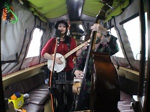 Banjo Jen and her Bass player Johnny Griff have now been playing together for around three years. Jen, an ex teacher, now tours different schools doing workshops teaching children about handling money and Johnny, Ex Royal Signals, is now an A&E Doctor. However we're so glad that their chosen vocations still give them enough time to produce superb music for us like this, their second song for us, 'Whisky Feet'. Jen was inspired to write this song whilst she was touring with Bradford based band Ho