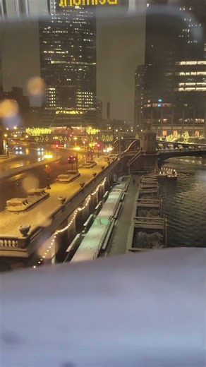 Evening L train over the river in downtown Chicago