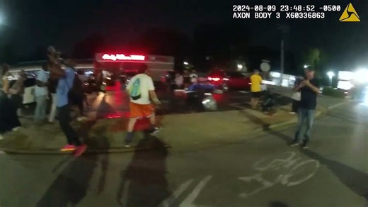 Raw video: Ferguson police release bodycam video of suspect 'charging' at officer during protest