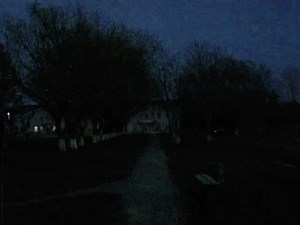 Mysterious Nighttime Pathway to a Lighted Structure