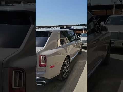 2021 Rolls Royce Cullinan, highlighting its unique color, luxury features, and the car key