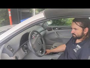 How do you open the convertible top of the Mercedes CLK?