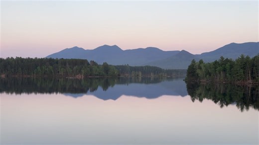 The view from Pines Market in Eustis ⛰️ Maine 🌲 looking across reflective Flagstaff Lake 🏞️ toward Bigelow Mountain ⛰️ just after sunset 🌅 on May 22, 2024 | Eustis Maine Scenery