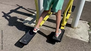 Exercise error. The leg breaks off. The girl performs exercises on the leg trainer, running and walking, stepper. Legs close up