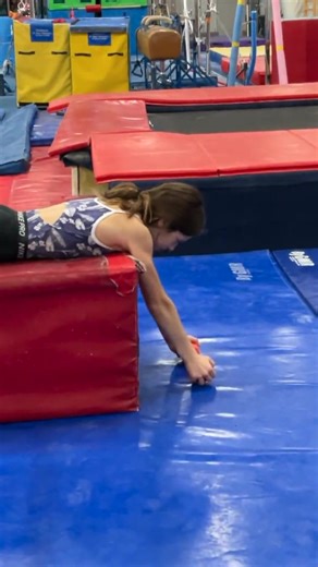 Here's an easy shoulder strength drill for cast handstands you can use to develop the upper back. The stronger the shoulder blades and upper back are, the most gymnasts can press down into the bar and utilize swing momentum for opening the shoulders fully. These are a great, simple side station to add in! | SHIFT Movement Science and Gymnastics Education