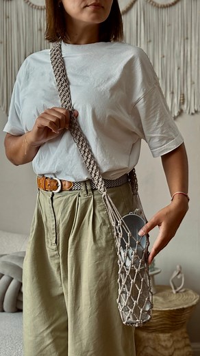 I needed a holder for my dog's water bottle, so I made one😊 It was quick and easy. I will try a few other styles and colours to add to my shop collection soon✨ I'm off the the walk now!🐾 #macramebottleholder #macrameshop #macramedesign #macramecreations #macrameaccessories | Between The Lines Macrame