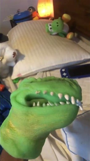 Shark puppet meets dinosaur puppet