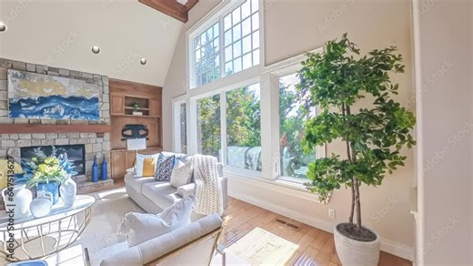 360-degree rotational view of a modern luxury home with a view of the living room, dining and kitchen area, and entryway