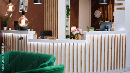 Empty stylish hotel entrance ready to welcome clients at reception, front desk used for check in procedure and bookings during vacation. Luxurious lobby with marble floors, hospitality industry.